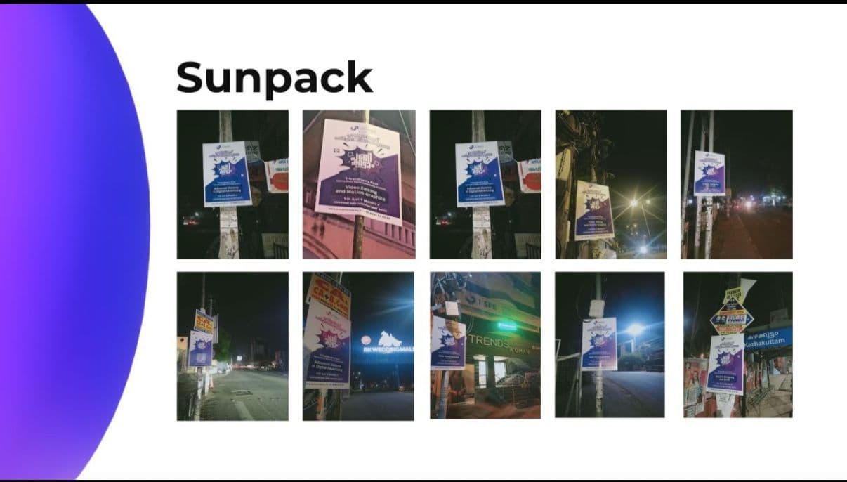 Sunpack posters on city poles at night